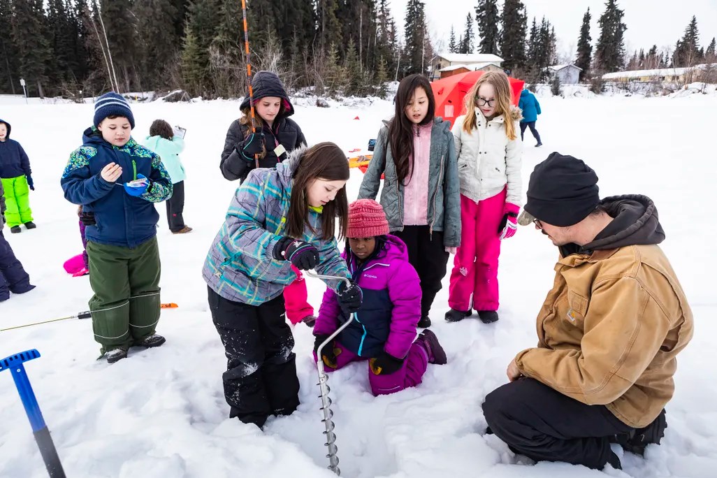 Students at Anne Wien Elementary School in Fairbanks pilot test the Fresh Eyes on Ice data collection protocol with project team member Allen Bondurant in 2019. UAF photo by  J.R. Ancheta