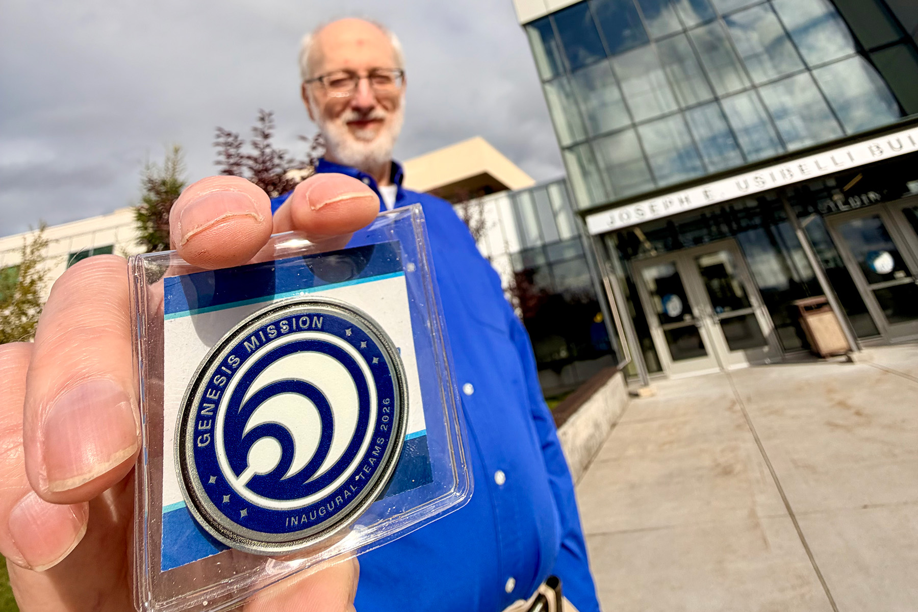 UAF professor Richard Wies is holding a Genesis Mission plaque. Wies is leading AURORA-AI which is part of the U.S. Department of Energy’s program.