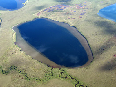 Deep dune-trough lake connected by beaded streams